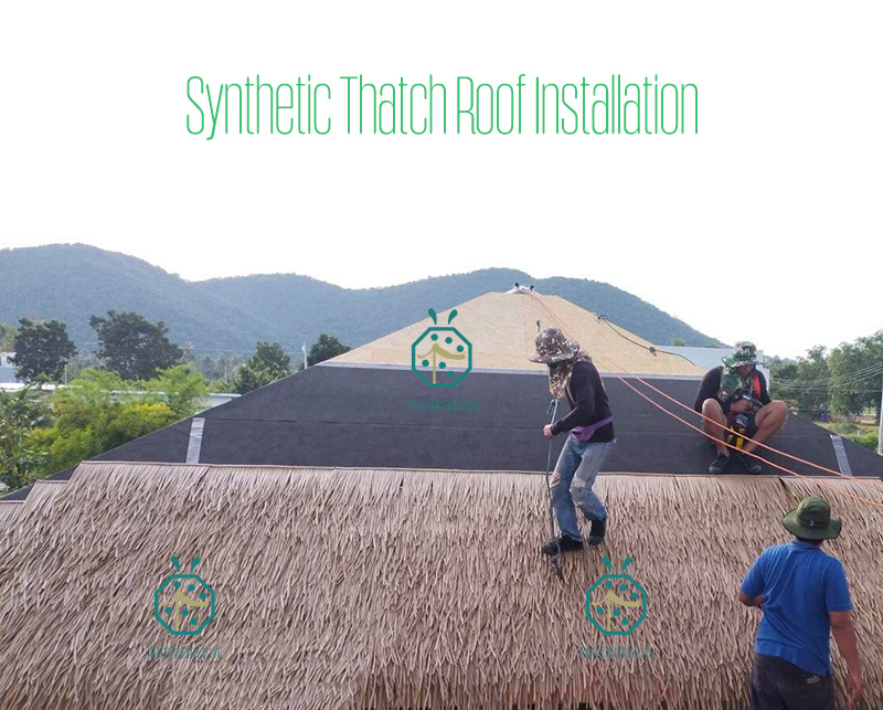 Durable Straw Thatched Roof Installation by Workers Durable Straw Thatched Roof Installation by Workers